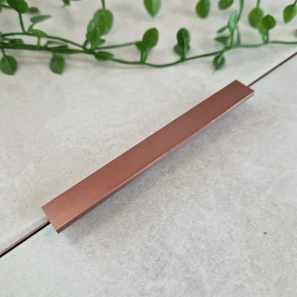A image of the genesis esa.99 metal tile trim in bright rose finish. Bright rose tile trim available in 8mm, 10mm, 12mm.